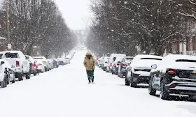 Snow and sleet pour down in Northeast after ice storm knocked out power to more than 1 million